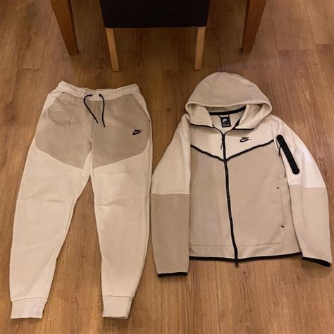 beige nike tech tracksuit.